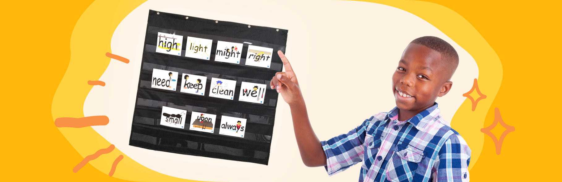 Banner of a boy pointing at a word chart