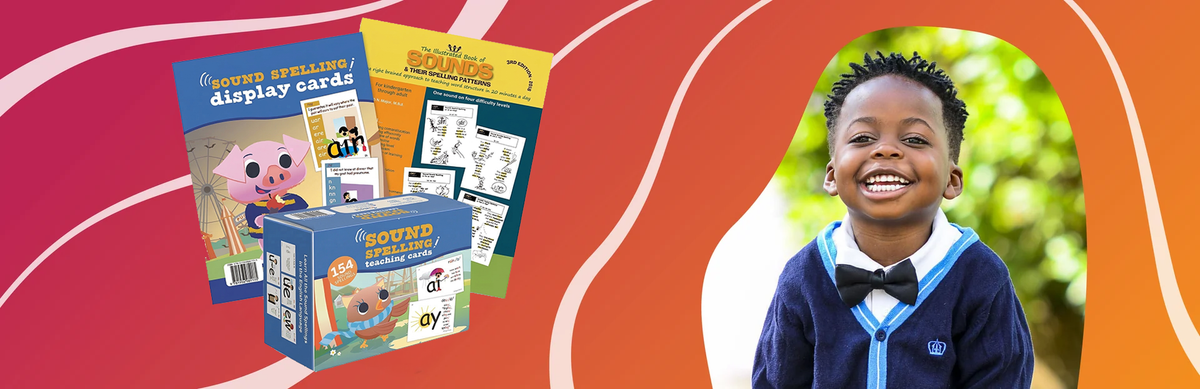 boy smiling with Phonics & Spelling Kit
